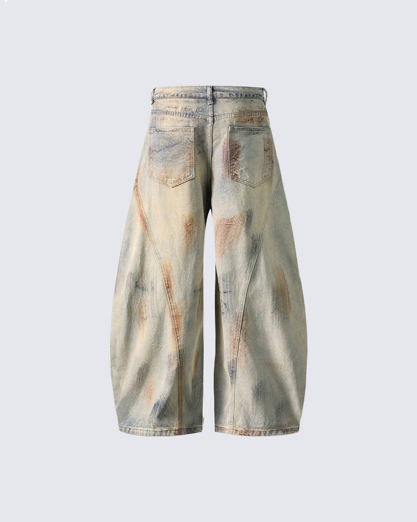 Arc-Cut Distressed Wide-Leg Jeans