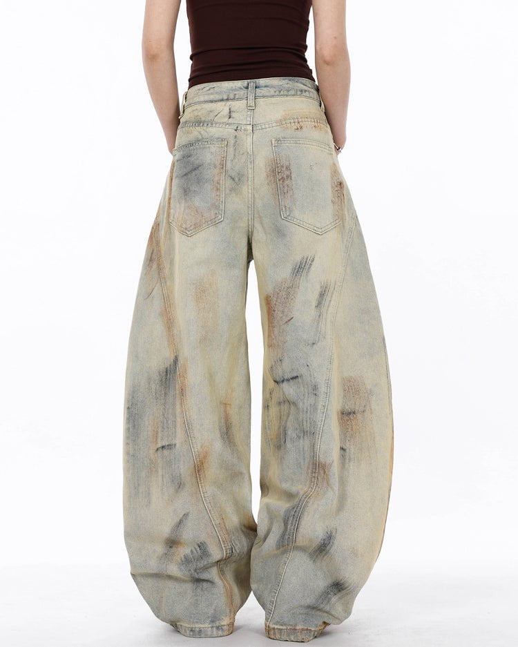 Arc-Cut Distressed Wide-Leg Jeans