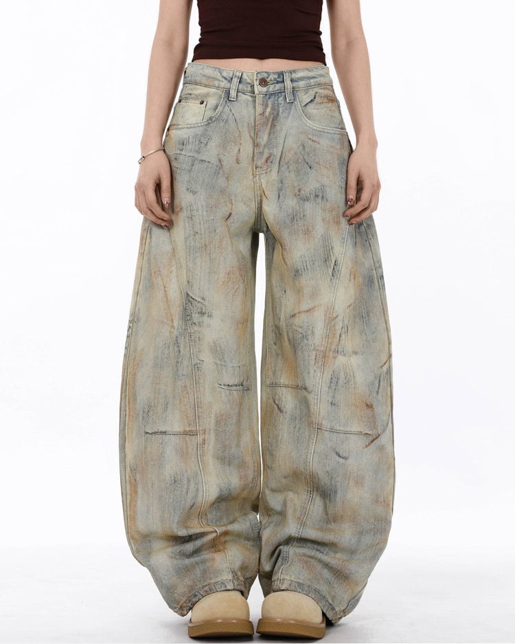 Arc-Cut Distressed Wide-Leg Jeans