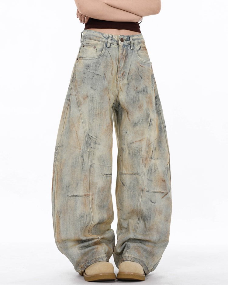 Arc-Cut Distressed Wide-Leg Jeans